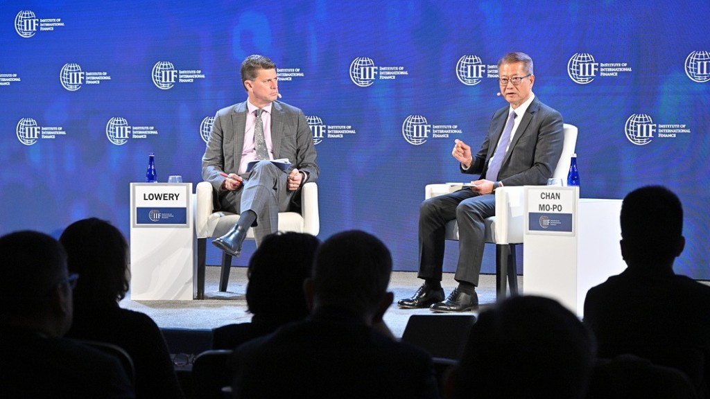 Paul Chan (right) attends the Annual Meetings of the International Monetary Fund and World Bank. From government.