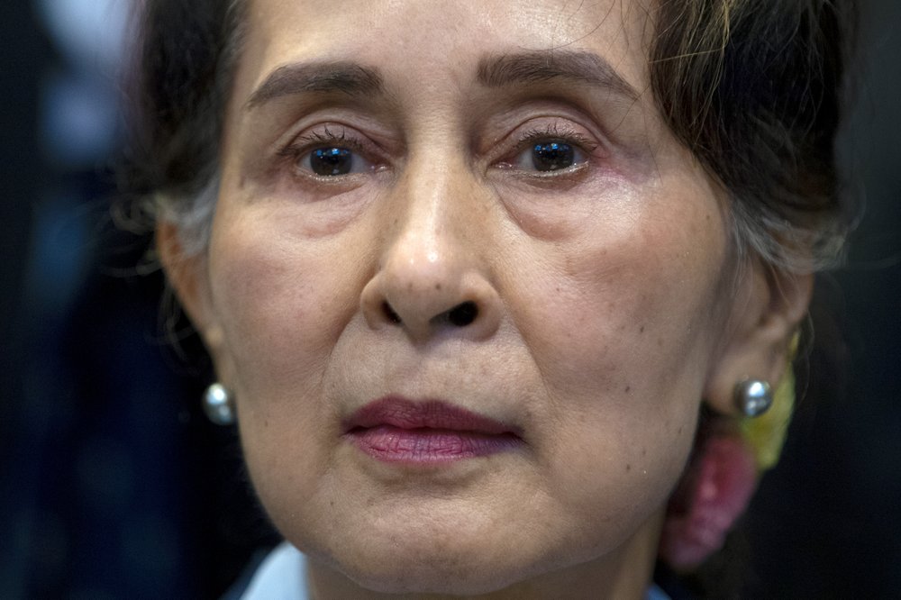 In this Dec. 11, 2019, file photo, Myanmar's leader Aung San Suu Kyi waits to address judges of the International Court of Justice on the second day of three days of hearings in The Hague, Netherlands. In this Dec. 11, 2019, file photo, Myanmar's leader Aung San Suu Kyi waits to address judges of the International Court of Justice on the second day of three days of hearings in The Hague, Netherlands.