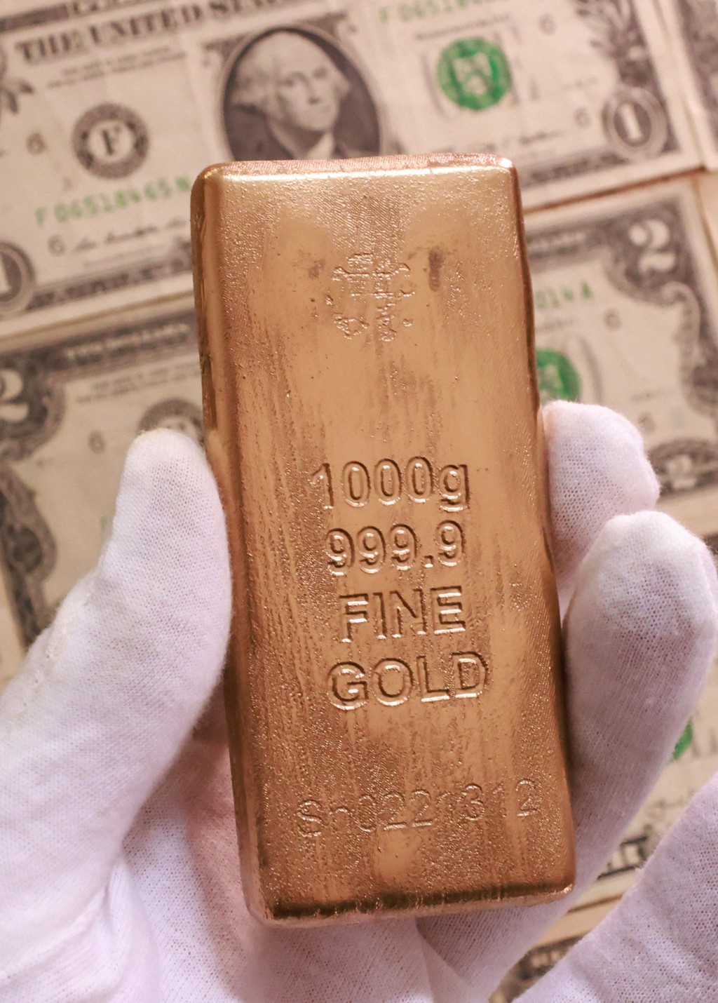 Gold imitation and US dollar banknotes are seen in this illustration picture taken February 20, 2026. REUTERS/Dado Ruvic/Illustration