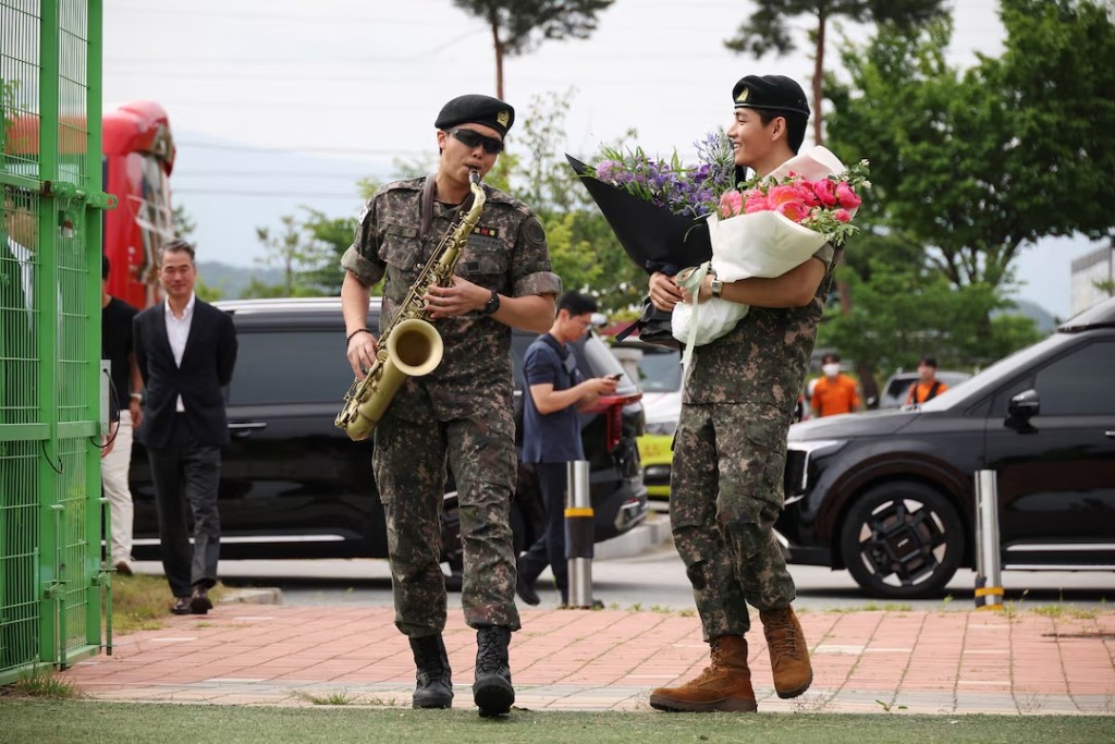 BTS members V and RM, arrive for an event after being discharged from South Korea’s mandatory military service, in Chuncheon, South Korea, June 10, 2025. REUTERS/Kim Hong-Ji