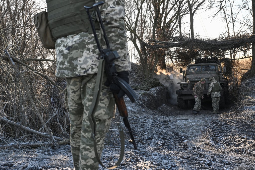 Service members of the 152nd Jaeger Brigade of the Ukrainian Armed Forces stand next to a BM-21 Grad multiple rocket launch system at their position in a front line, amid Russia's attack on Ukraine, in Donetsk region, Ukraine December 25, 2025. (Reuters)