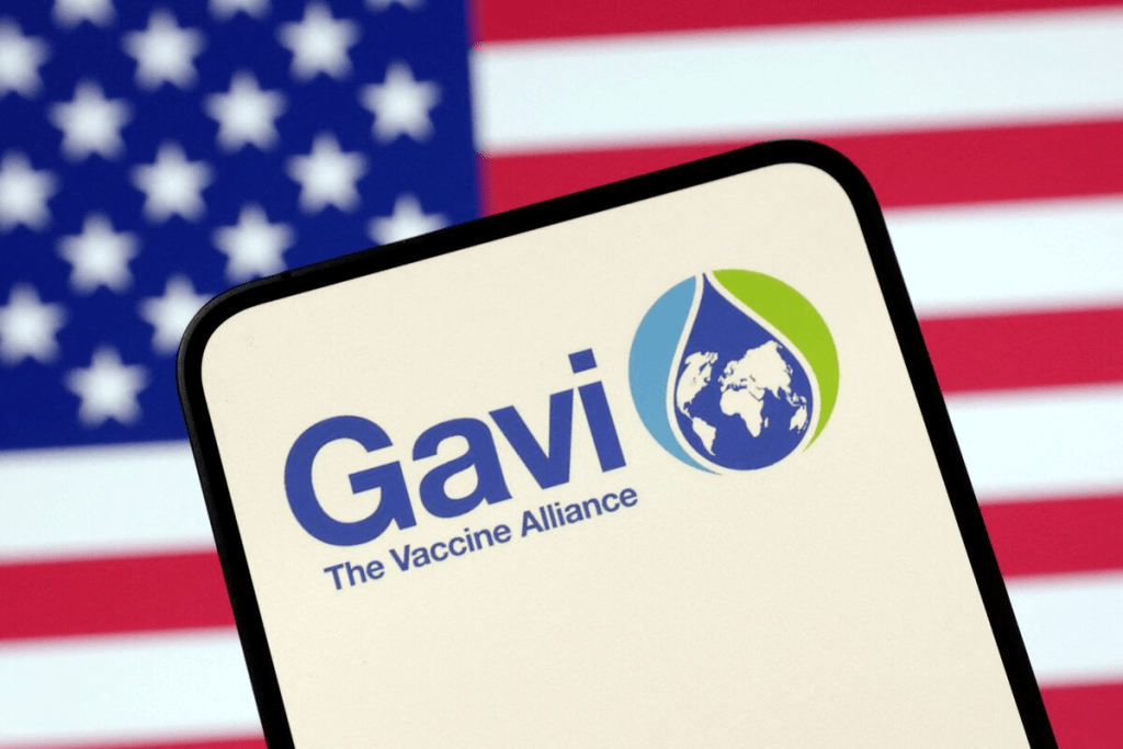 The Vaccine Alliance (GAVI) logo and U.S. flag are seen in this illustration taken April 23, 2025. REUTERS/Dado Ruvic/Illustration/File Photo