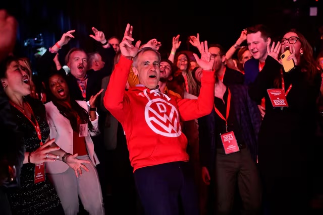 Canada's Prime Minister Mark Carney dances during an event at the Liberal Party election night headquarters in Ottawa, Ontario, Canada April 29, 2025. REUTERS/Jennifer Gauthier