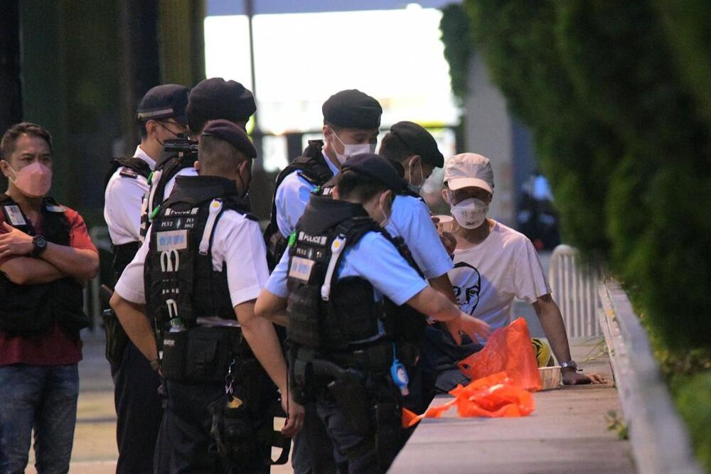 Police stop and search Lau Shan-ching. SING TAO Police stop and search Lau Shan-ching. SING TAO