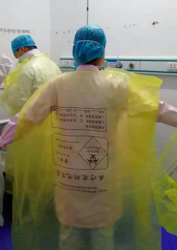 Covers for medical supplies are turned into gowns in a Wuhan hospital. Covers for medical supplies are turned into gowns in a Wuhan hospital.