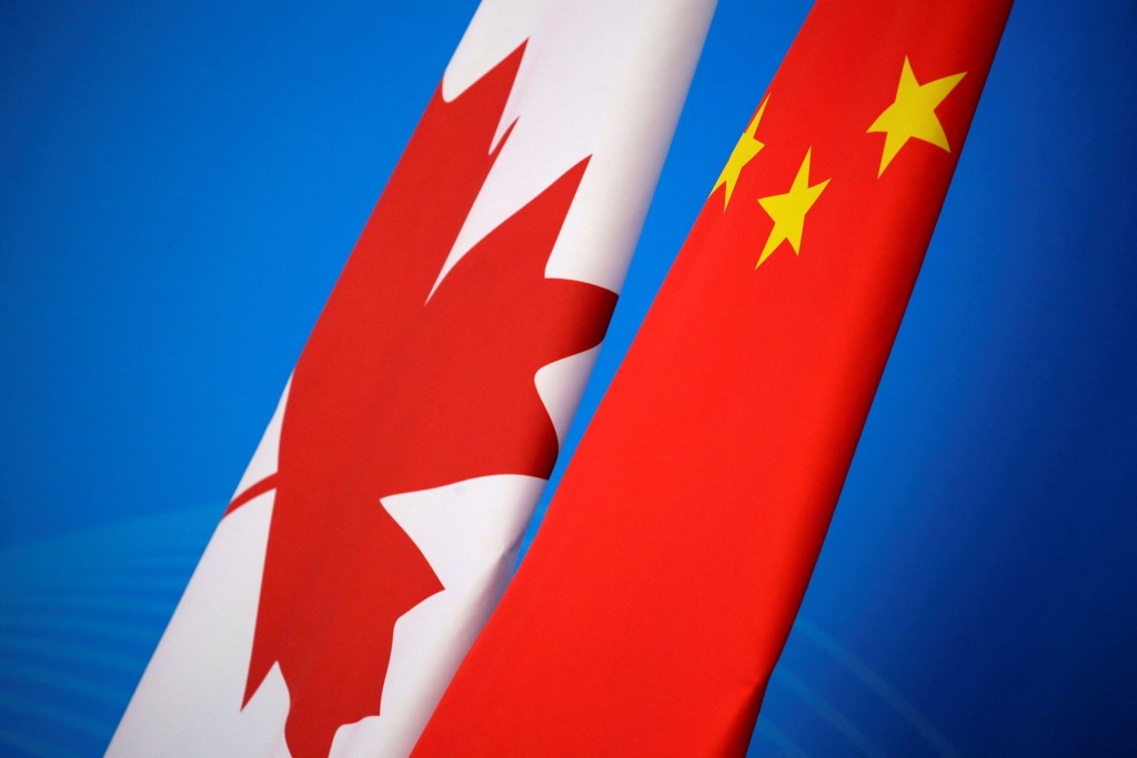 Flags of Canada and China are placed for the first China-Canada economic and financial strategy dialogue in Beijing, China, November 12, 2018. REUTERS/Jason Lee/Pool/File Photo