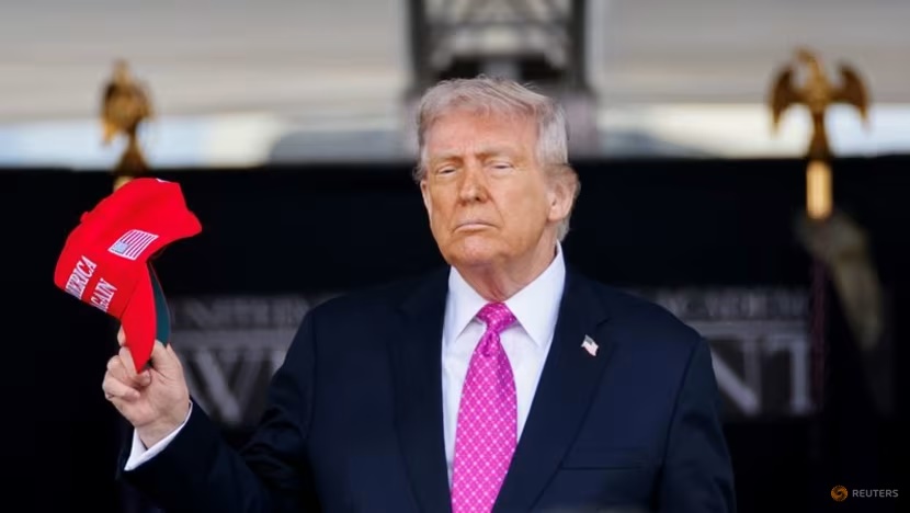 US President Donald Trump holds a 'Make America Great Again' (MAGA) hat as he attends the commencement ceremony at West Point Military Academy in West Point, New York, US on May 24, 2025. (File photo: REUTERS/Eduardo Munoz)
