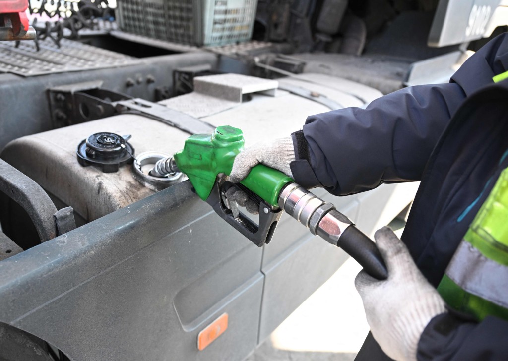 A man fills up a truck at a petrol station of an Inland Container Depot (ICD) terminal in Uiwang on March 13, 2026. AFP
