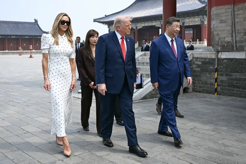 China's President Xi Jinping (R) and US President Donald Trump (C) visit the Temple of Heaven in Beijing on May 14, 2026. BRENDAN SMIALOWSKI/Pool via REUTERS 