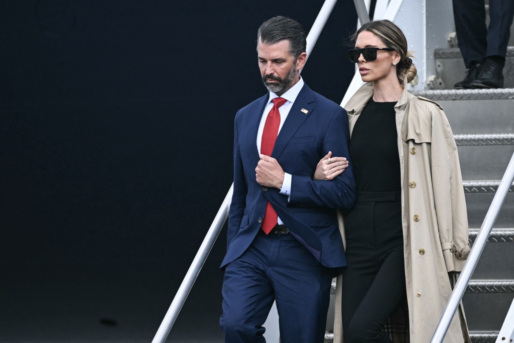 Photo by BRENDAN SMIALOWSKI / AFP  Donald Trump Jr. and his wife Bettina (R) disembark from Air Force One as they arrive with US President Donald Trump at Shannon Airport in Shannon, western Ireland on September 12, 2026, ahead of his arrival to attend the Irish Open golf tournament in nearby Doonbeg.