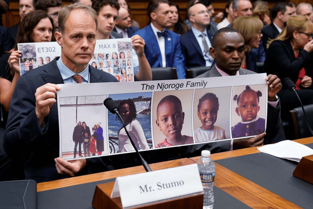 Michael Stumo, father of Samya Stumo, victim of Flight ET302; and Paul Njoroge hold a combination photo of Njoroge’s family members who were victims of EA Flight 302 during a House Transportation and Infrastructure Aviation Subcommittee hearing on "State of Aviation Safety" on Capitol Hill in Washington, U.S., July 17, 2019. REUTERS/Joshua Roberts/File Photo