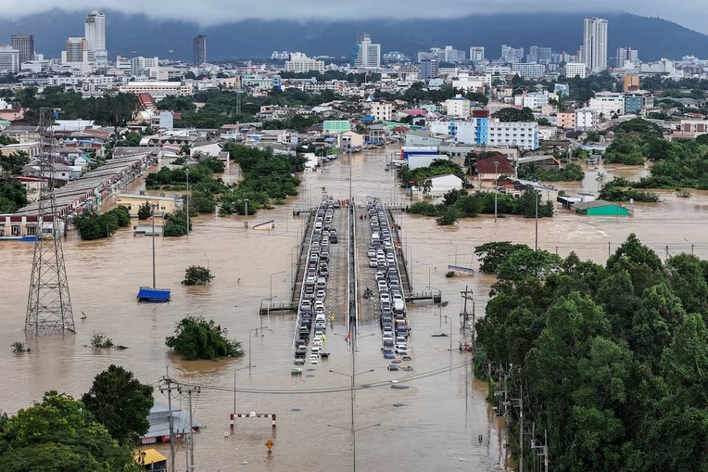 A drone view shows cars parked on a bridge to escape floodwaters in a flooded area in Hat Yai district, affected by heavy rainfall, which has impacted 10 provinces in southern Thailand and have killed several people, in Songkhla province, Thailand. REUTERS/Weerapong Narongkul