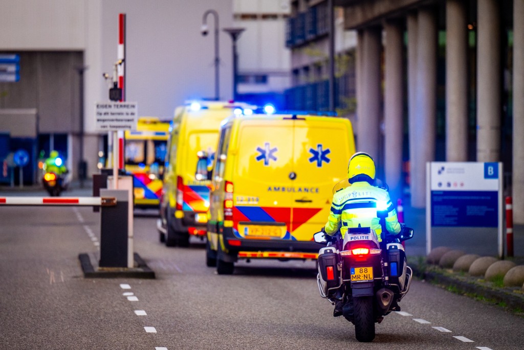 Photo by JOSH WALET / ANP / AFP  This photograph shows a view of a convoy of ambulances allegedly carrying at least one of the passengers from the cruise ship MV Hondius believed to be infected with hantavirus escorted by Dutch police on motorcycles as it arrives near Leiden University Medical Center (LUMC) in Leiden on May 6, 2026.