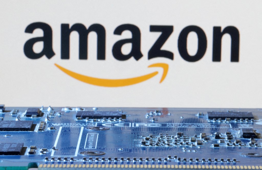 Amazon logo is seen near computer motherboard in this illustration taken January 8, 2024. REUTERS/Dado Ruvic/File Photo