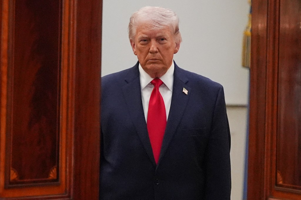 US President Donald Trump arrives to speak at a televised address on the conflict in the Middle East from the Cross Hall of the White House in Washington, DC on April 1, 2026. (AFP)