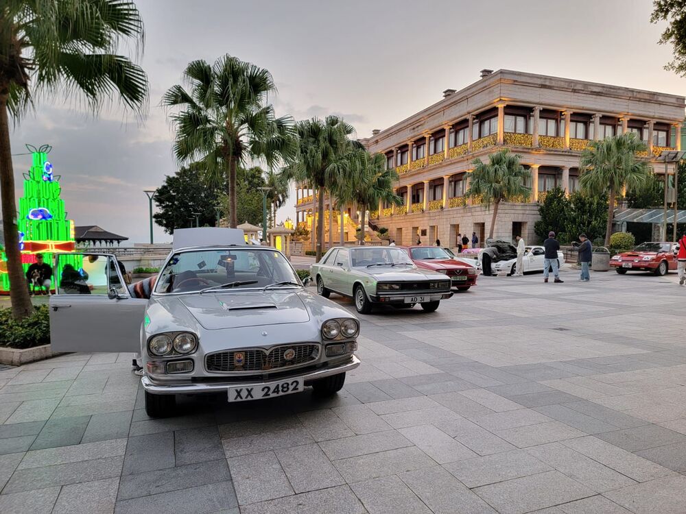 The 1964 Maserati Quattroporte against the backdrop of historic Murray House.
