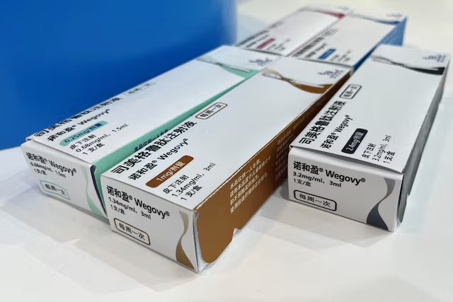 FILE PHOTO: Wegovy injector pen boxes are displayed at the Novo Nordisk booth at the China Obesity Congress 2025 (COC2025) in Beijing, China, August 17, 2025. REUTERS/Andrew Silver/File Photo/File Photo
