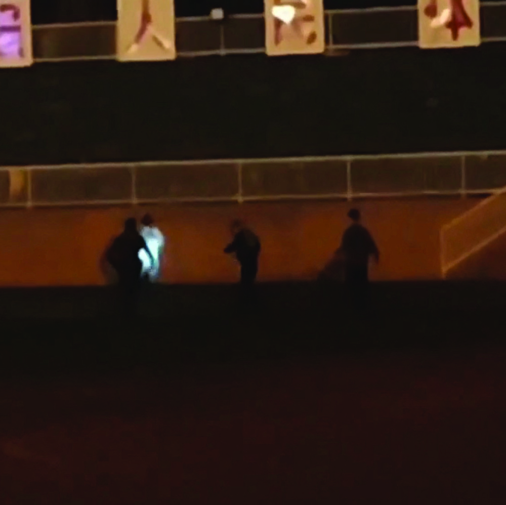 A screen grab from a social media video shows police apprehending the suspect and, left, bystanders at the scene of the rampage at the Wuxi Vocational College of Arts and Technology.
AP, REUTERS A screen grab from a social media video shows police apprehending the suspect and, left, bystanders at the scene of the rampage at the Wuxi Vocational College of Arts and Technology.
AP, REUTERS