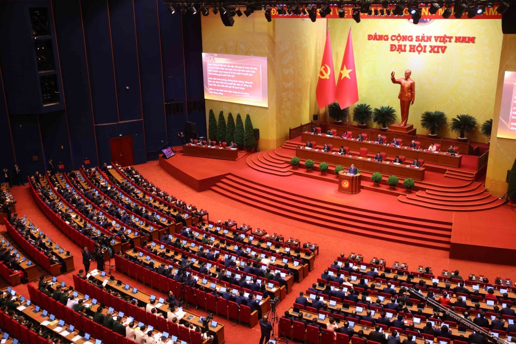 This handout photo taken on January 20, 2026 and released by the 14th National Congress via the Vietnam News Agency shows delegates taking part in the opening session of the 14th National Congress of the Communist Party of Vietnam at the National Convention Centre in Hanoi. (Photo by Handout / Vietnam News Agency (VNA) / AFP)