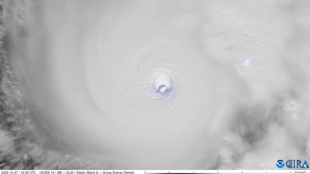 Lightning flashes within the eye of Hurricane Melissa over the Caribbean Sea, as seen from space, October 27, 2025, in this screengrab from satellite footage. CSU/CIRA & NOAA/Handout via REUTERS
