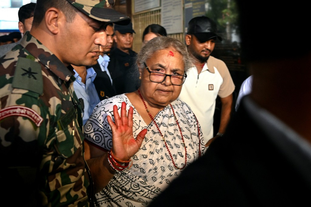 Newly-elected Prime Minister of Nepal’s interim government Sushila Karki (C) arrives at the National Trauma Center hospital to visit victims injured in clashes with security personnel, in Kathmandu on September 13, 2025. (AFP)