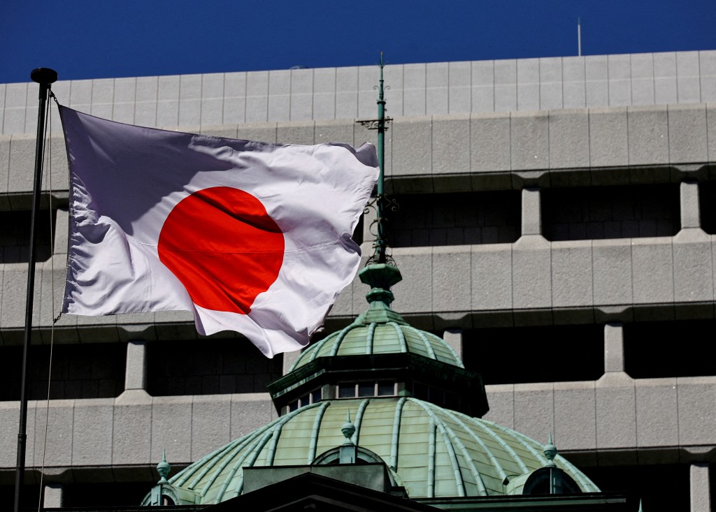 The Japanese national flag waves at the Bank of Japan building in Tokyo, Japan March 18, 2024. REUTERS/Kim Kyung-Hoon/File Photo