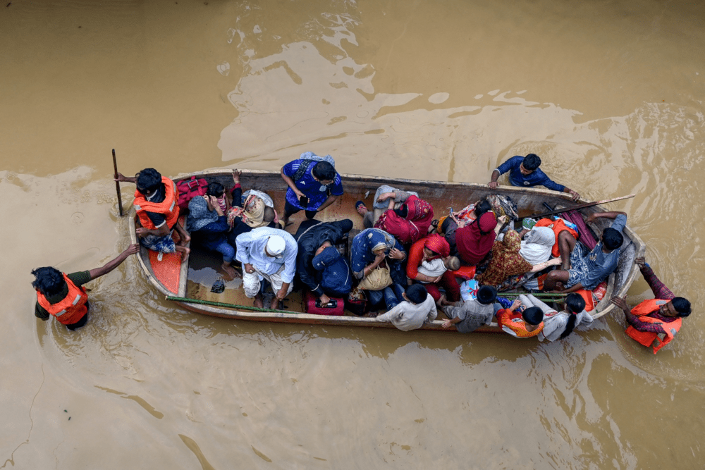 Volunteers rescue flood-affected residents in Feni, in south-eastern Bangladesh, on Aug. 23Photographer: Munir Uz Zaman/AFP/Getty Images Volunteers rescue flood-affected residents in Feni, in south-eastern Bangladesh, on Aug. 23Photographer: Munir Uz Zaman/AFP/Getty Images
