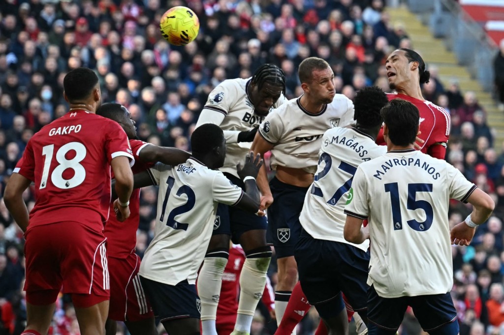 Virgil van Dijk heads in Liverpool's second goal against West Ham from a set-piece at Anfield. AFP