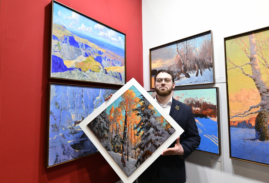 Nikita Mogilevtsev holds one piece named 'Morning Song' from his newest collection of works.