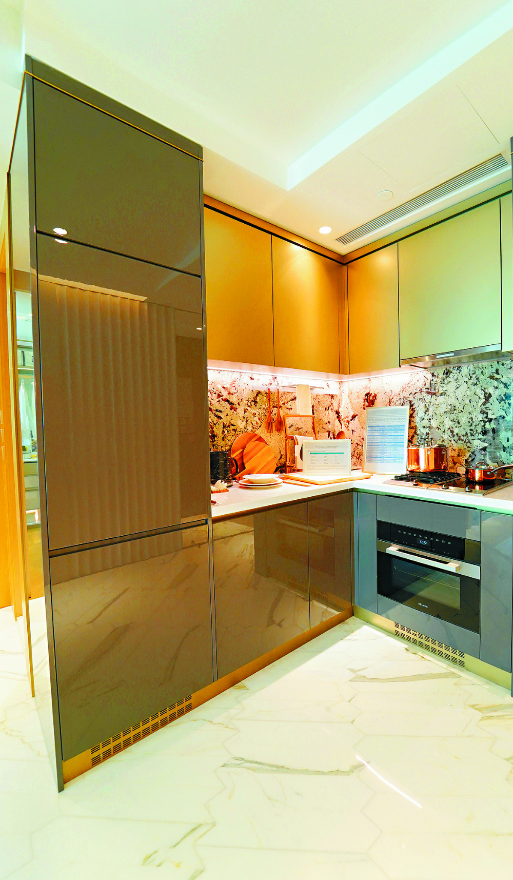 WHAT’S COOKING: The open kitchen has ample cabinet space.