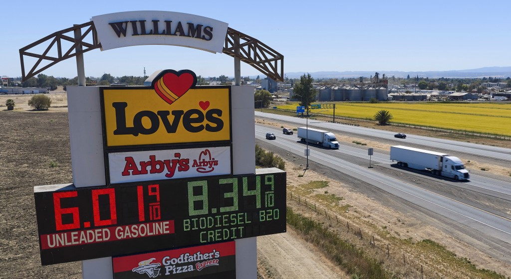 Semis drive past a sign advertising gas and diesel prices along Interstate 5 in Williams, California, U.S., September 28, 2026. REUTERS/Fred Greaves