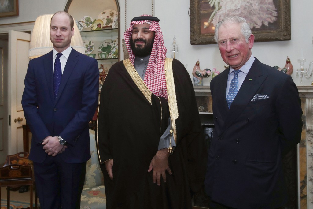Photo by YUI MOK / POOL / AFP  Britain's then-Prince Charles, Prince of Wales (R) and Britain's Prince William (L) meet with Saudi Arabia's Crown Prince Mohammed bin Salman (C) for dinner at Clarence House in central London on March 7, 2018.