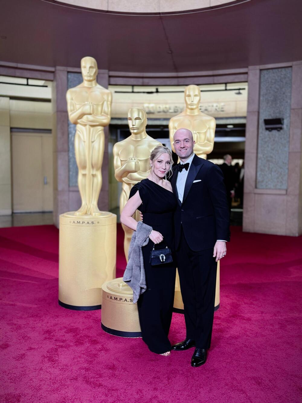 Rolex Greater China CEO Maxim Lamarre and his wife attend the Oscars gala.