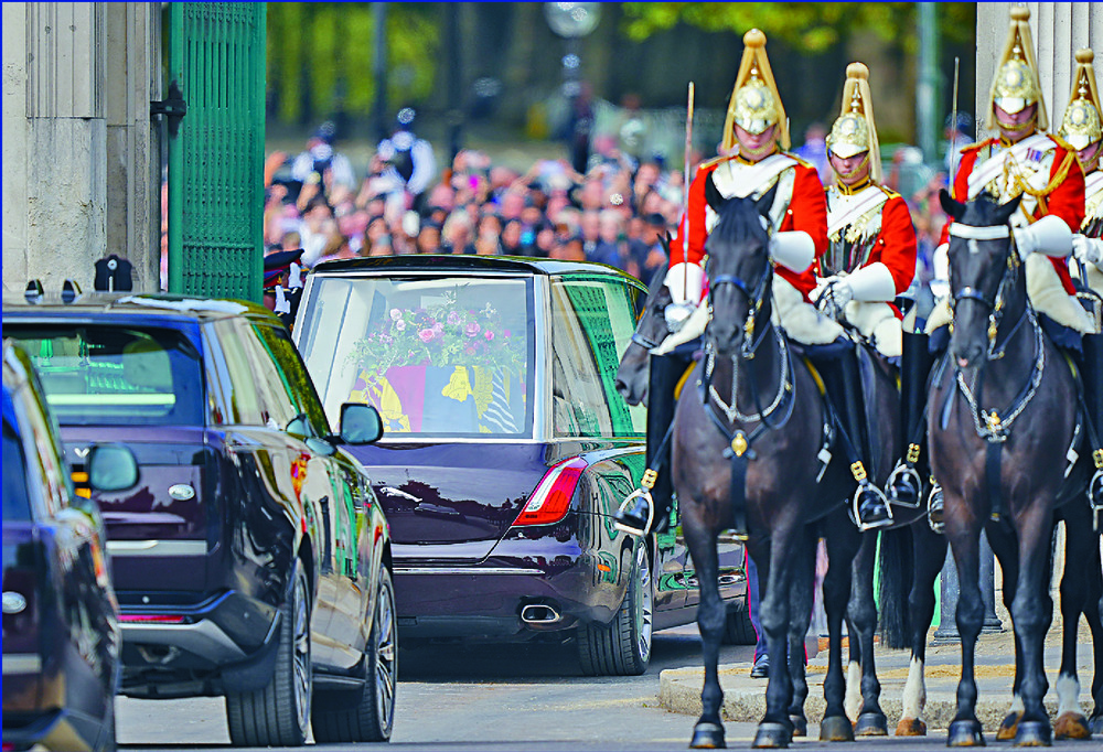 The coffin is transported as Prince Harry and Princess Anne follow. Meghan, Camilla, queen consort, Prince George and Catherine, Princess of Wales leave Westminster Abbey. AP, AFP