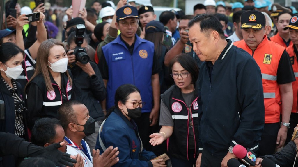 Thailand’s caretaker PM Anutin Charnvirakul visits the site where a train was derailed. Reuters