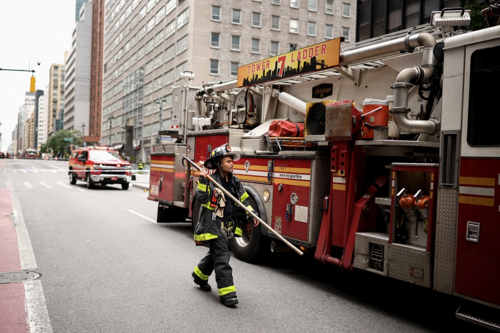 Photo by CHARLY TRIBALLEAU / AFP  Firefighters from the New York City Fire Department (NYFD) respond to a building that has been evacuated in the Manhattan borough of New York City on July 7, 2026.