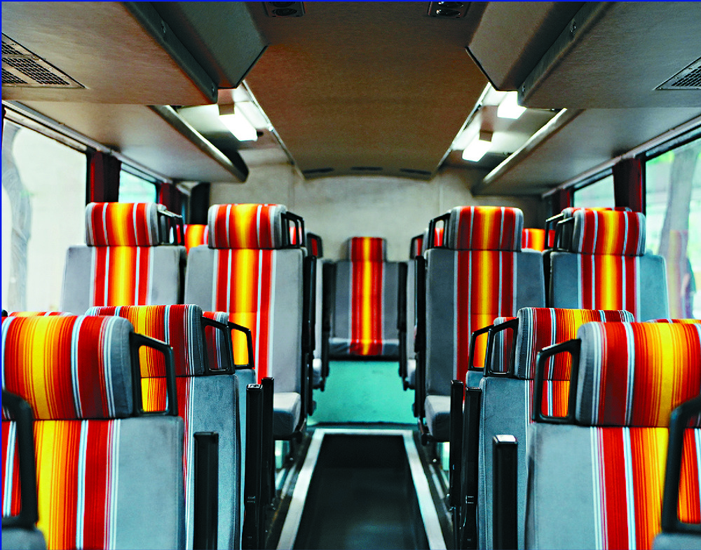 The refurbished Leyland Olympian bus features the classic gray, red and yellow striped seats on the inside and the iconic logo on the outside. Sing Tao The refurbished Leyland Olympian bus features the classic gray, red and yellow striped seats on the inside and the iconic logo on the outside. Sing Tao