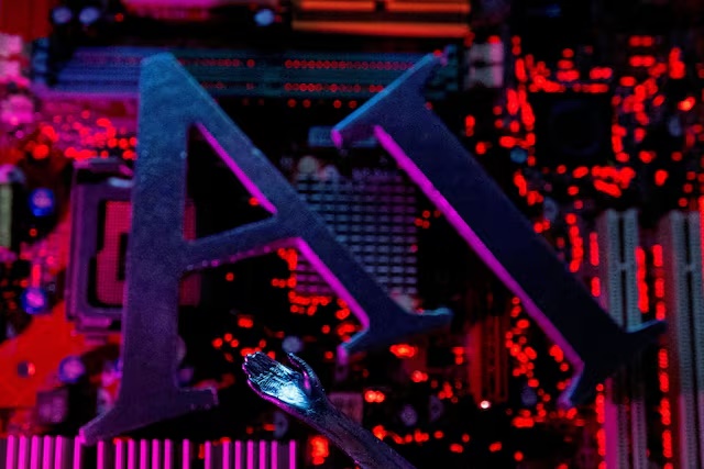 AI letters and robot hand are placed on computer motherboard in this illustration created on June 23, 2023. REUTERS/Dado Ruvic/Illustration/File Photo