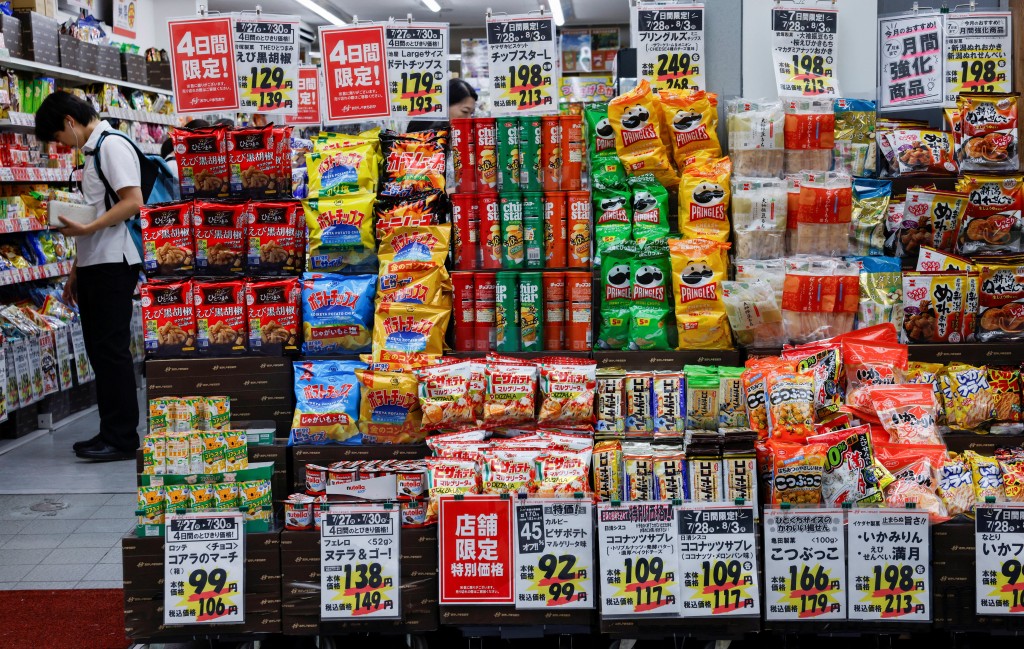 People shop for snacks at a confectionery store in Tokyo, Japan, July 28, 2026. REUTERS