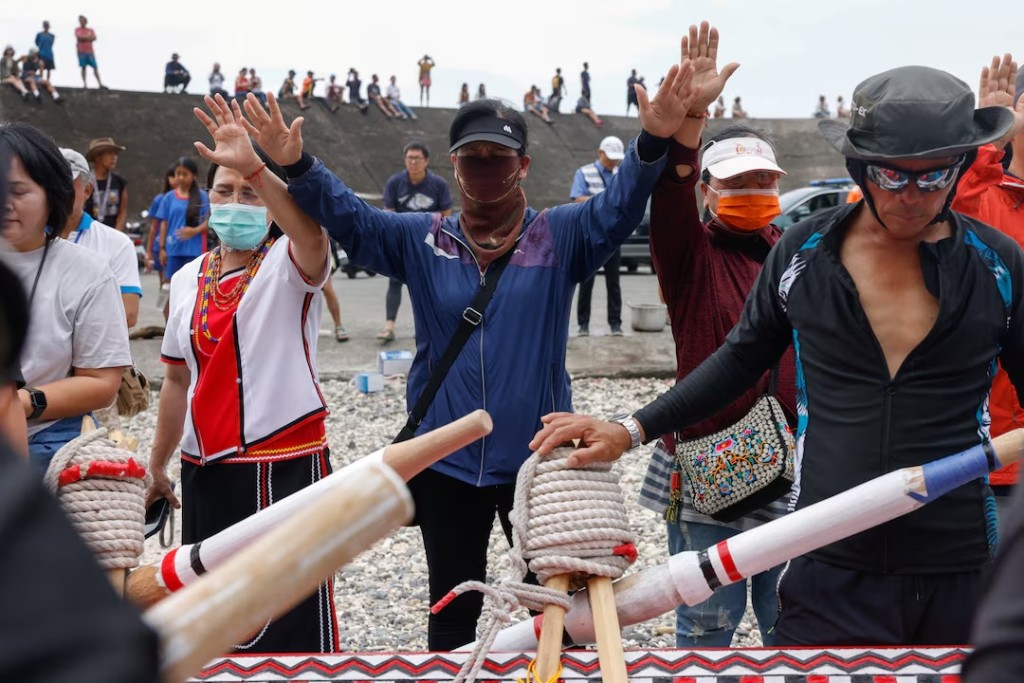 Women gather to pray for the crew before they set off on a journey in a traditional wooden canoe named Ovayan, or "Golden Friendship," to the Philippines' Batanes Islands, on Orchid Island, Taiwan, June 15, 2026. REUTERS/Ann Wang