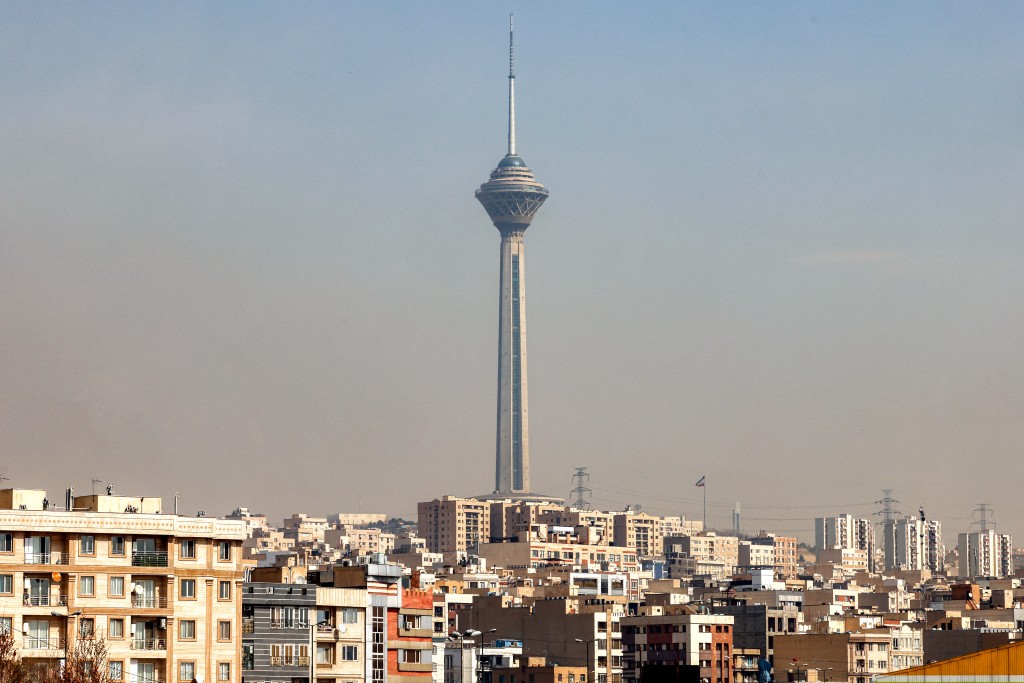 Photo by ATTA KENARE / AFP  Milad (Birth) Tower, the tallest tower in Iran at 435 metres, is pictured in the Tehran skyline on February 23, 2026.