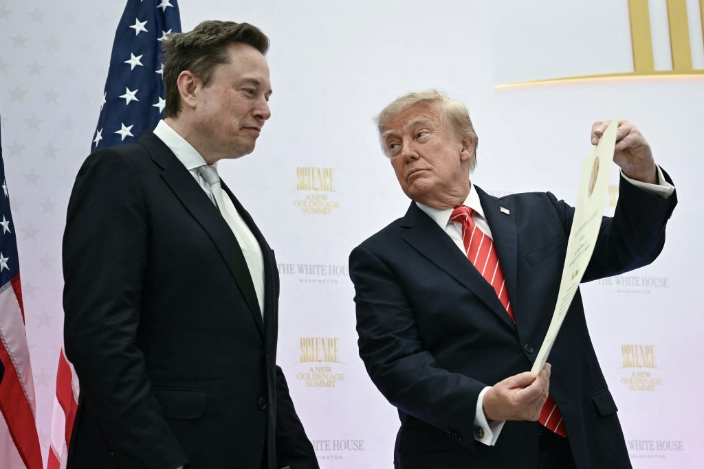US President Donald Trump presents the National Medal of Science to Elon Musk during the "Golden Age of American Innovation Summit" at the Institute of Peace in Washington, DC, on October 8, 2026. (Photo by Kent NISHIMURA / AFP)