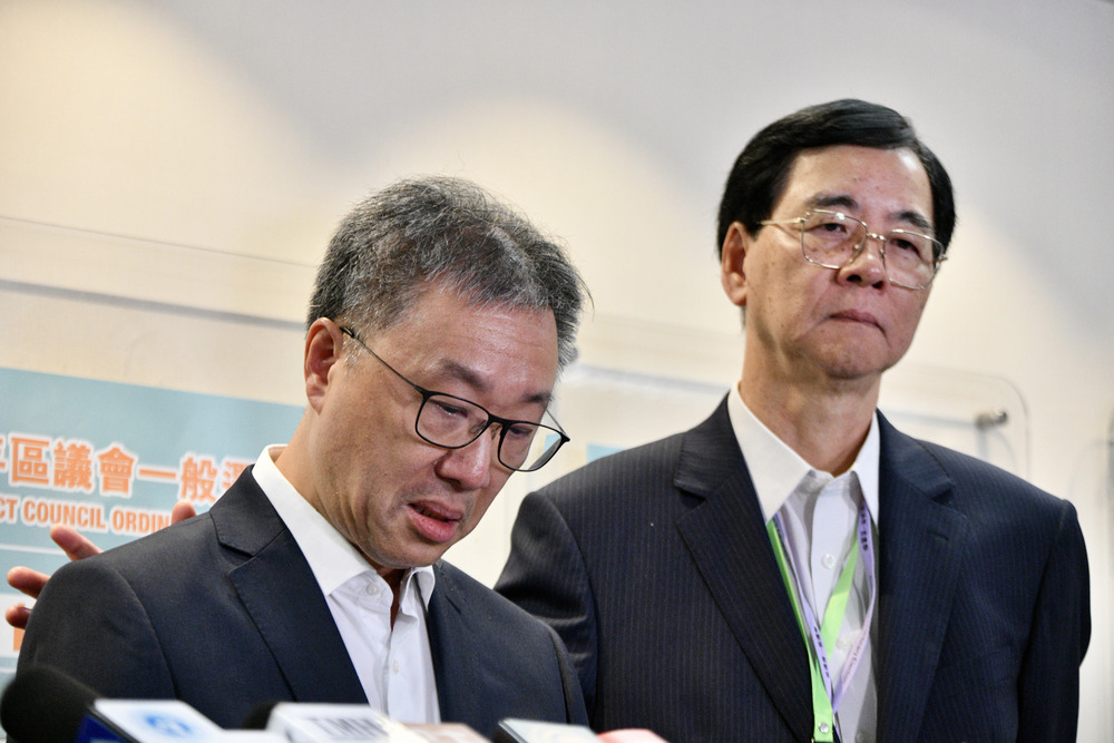 David Lok, left, and Daniel Shek of the EAC. SING TAO David Lok, left, and Daniel Shek of the EAC. SING TAO