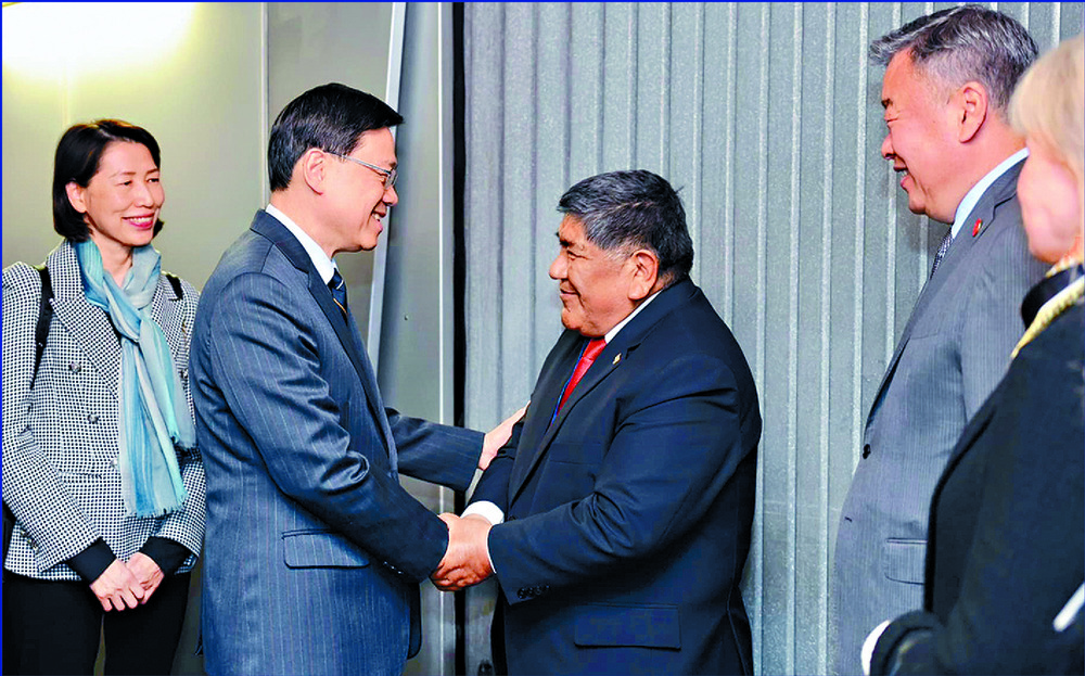 John Lee, left, arrives in Lima, Peru. John Lee, left, arrives in Lima, Peru.