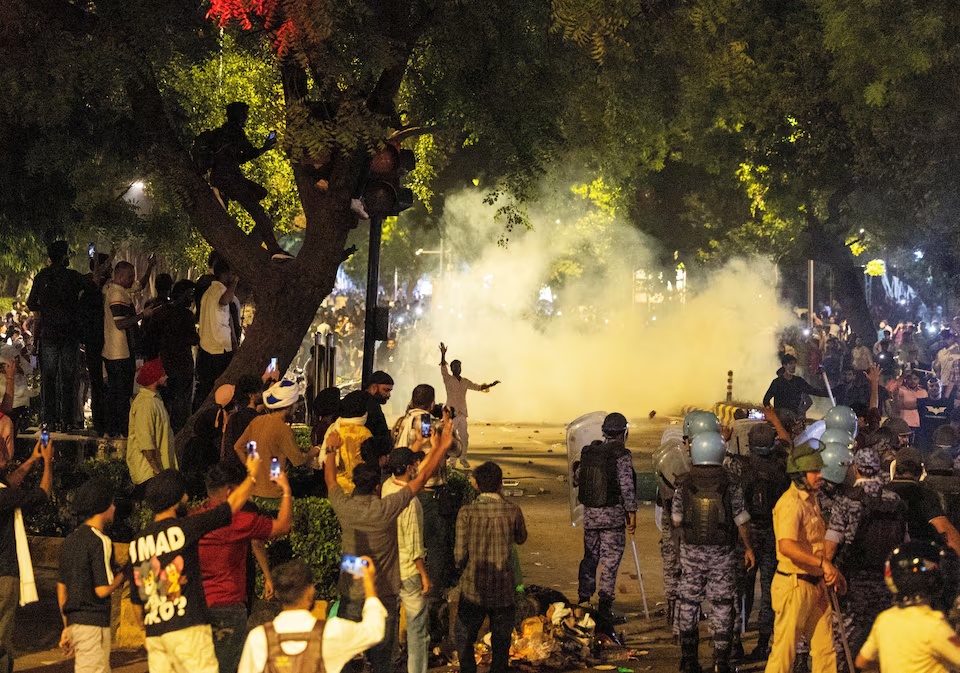Police use teargas to control the crowd during the ongoing protest of Cockroach Janata Party (CJP), two days after thousands of protesters marched towards parliament demanding the resignation of Education Minister Dharmendra Pradhan over examination paper leaks, at Jantar Mantar in New Delhi, India, July 22, 2026. REUTERS/Adnan Abidi