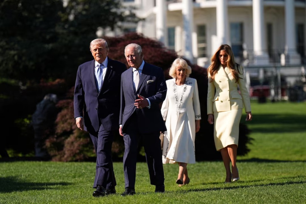 Britain's King Charles and Queen Camilla walk as they join US President Donald Trump and US First Lady Melania for a tour of the White House beehives in the grounds of the White House, on day one of the state visit to the US, in Washington D.C., U.S., April 27, 2026. Aaron Chown/Pool via REUTERS