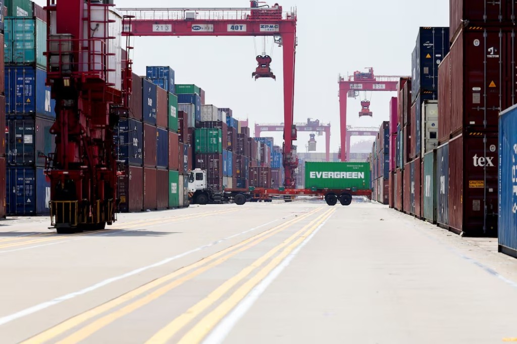  Gantry cranes stand near shipping containers at Yangshan Port outside of Shanghai, China, June 17, 2025. REUTERS/Go Nakamura