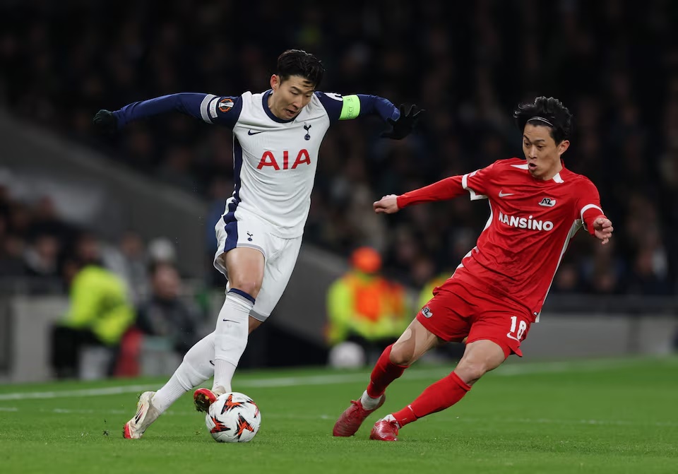 Tottenham Hotspur's Son Heung-min in action with AZ Alkmaar's Seiya Maikuma. (Reuters)