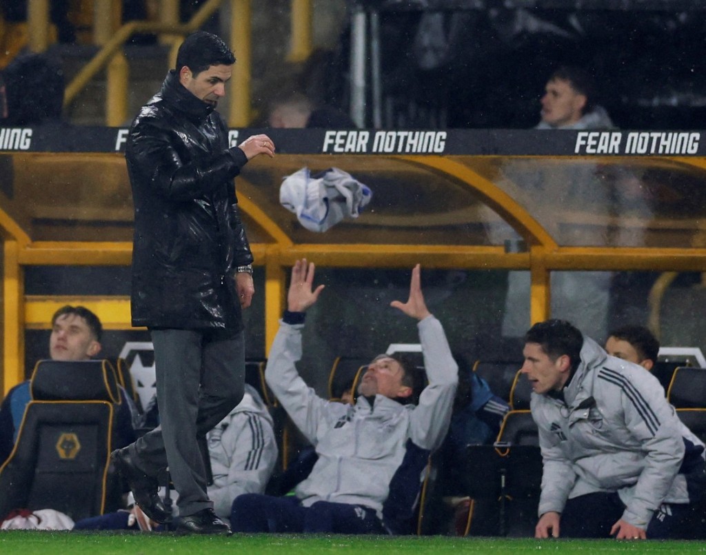 Mikel Arteta and the Arsenal coaching staff react to the equalizer from Tom Edozie. REUTERS