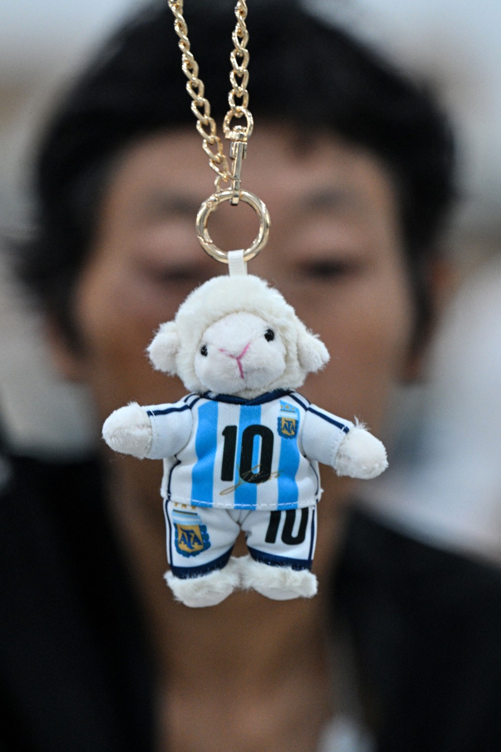 Photo by HECTOR RETAMAL / AFP  In this photo taken on June 5, 2026, a worker packs merchandise of Lionel Messi of Argentina's national football team, which will participate in the FIFA World Cup 2026, at the All Star Partner factory in Yiwu in eastern China's Zhejiang province.